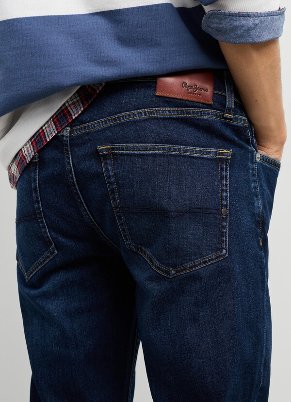 STANLEY - TAPER FIT MID-RISE JEANS